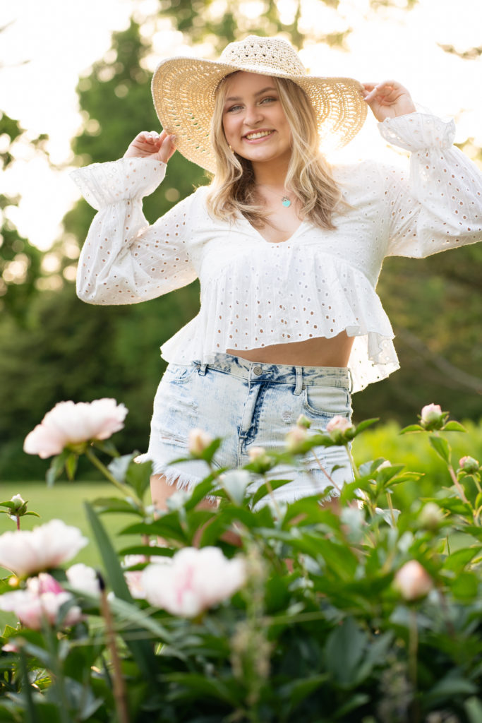Ethereal light with High School Senior with a cute smile at Long Wood Gardens photographer Susan Grace Photography