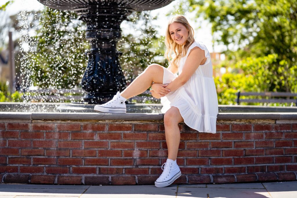 High School Senior photos by the fountain in the town of Cape May NJ with Susan Grace Photography