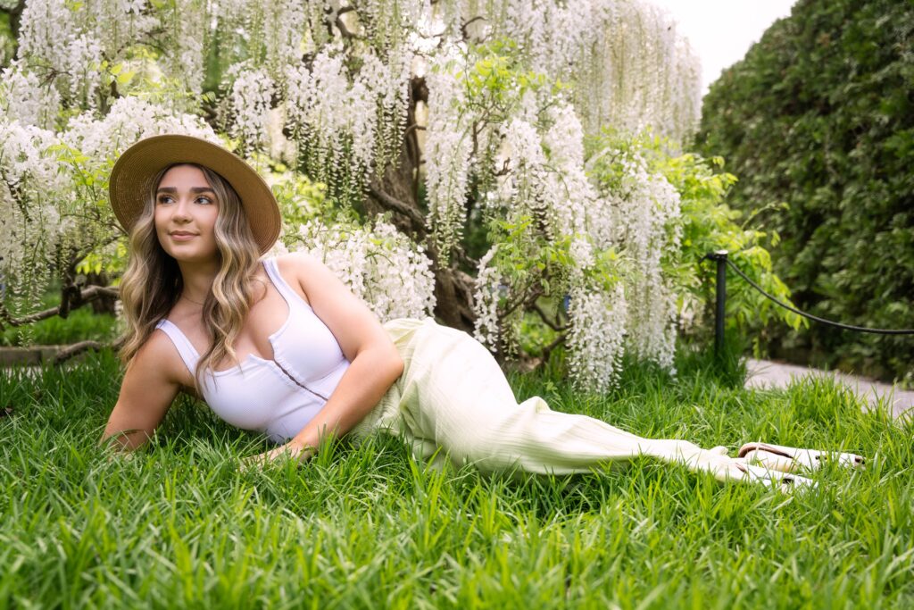 Beautiful spring blooming wisteria and. high school senior at Longwood Gardens with Susan Grace Photography senior photos