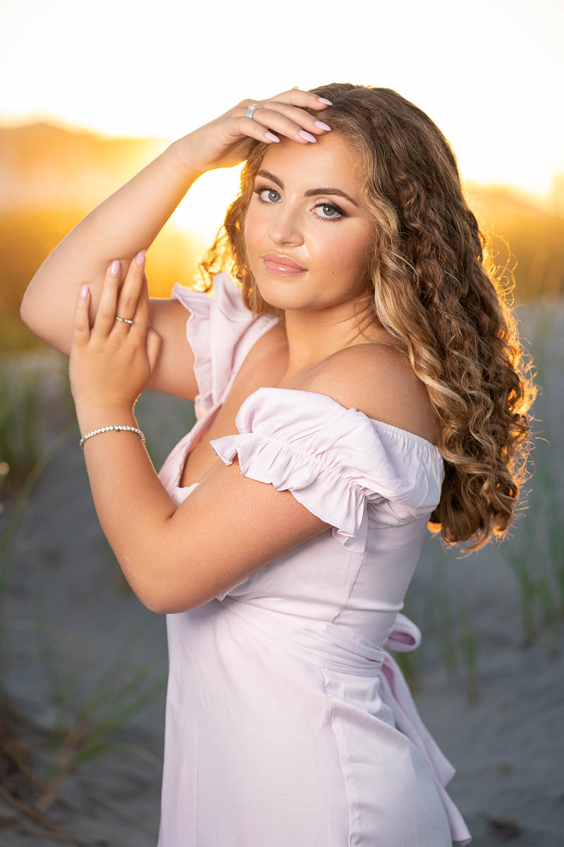 Beautiful Washington Township senior portrait on the beach with the sun setting in the backround