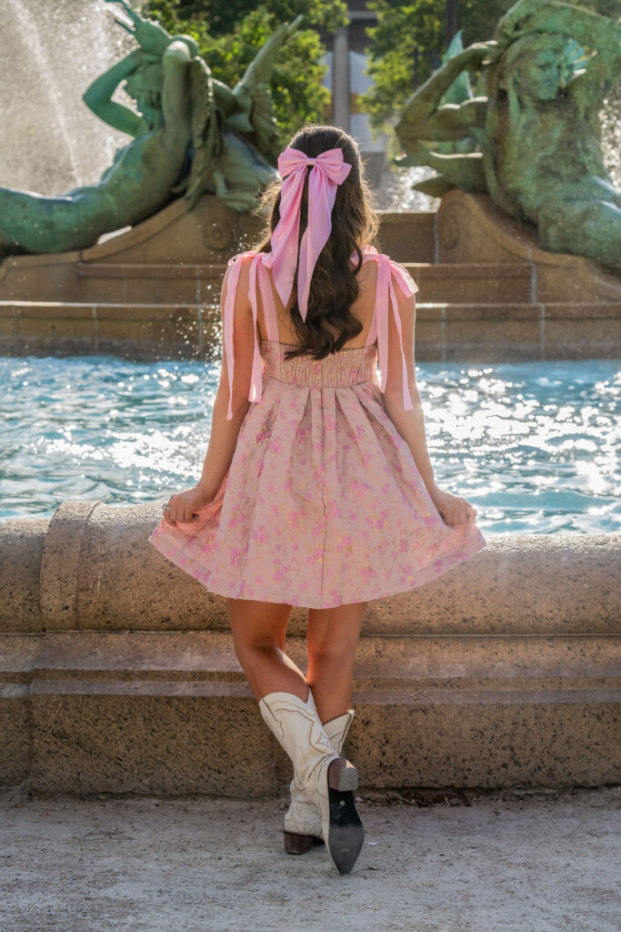 Senior wearing lace and pink posing downtown in New Jersey by photographer Susan Grace