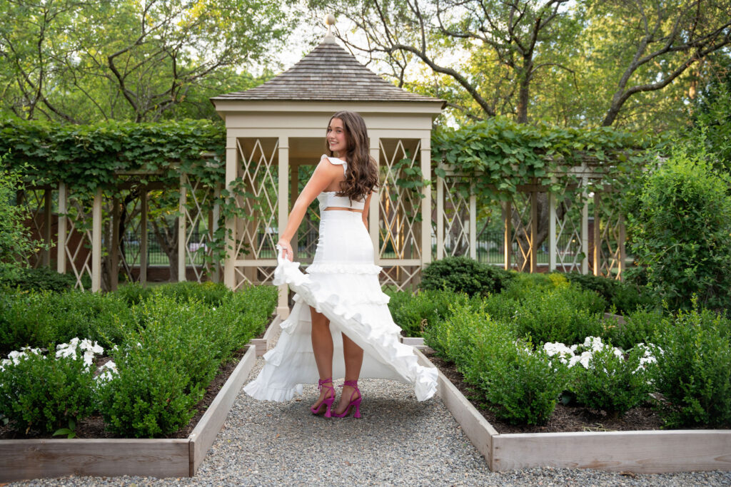 Gorgeous senior in white dress outside a gazebo by Susan Grace photography