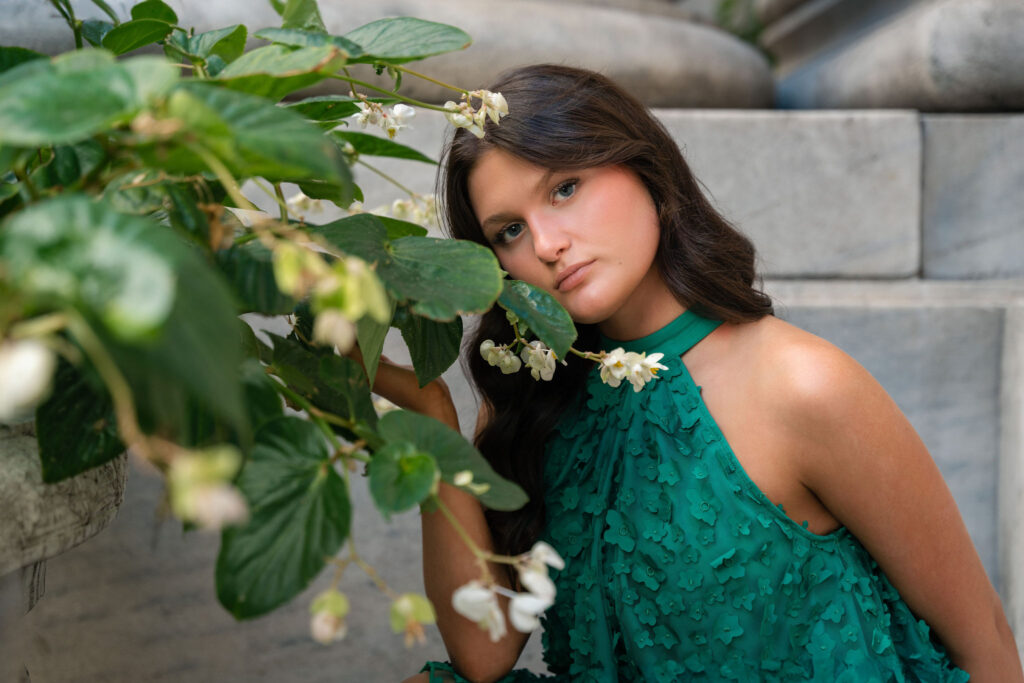 Aubrey's photo in the city in a green dress. Senior photography by Susan Grace Photography