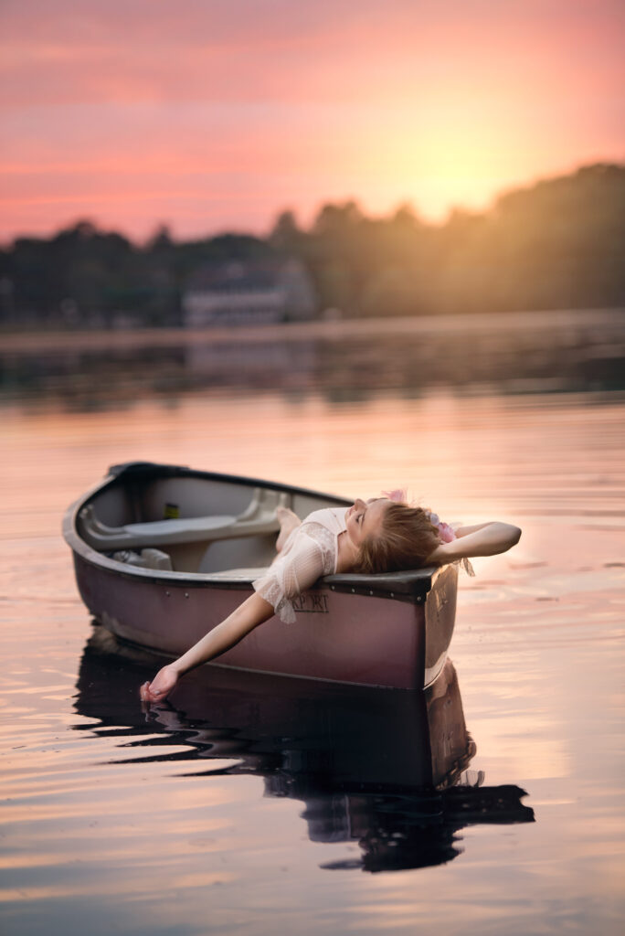 Sunset senior image adrift in a boat New Jersey senior photographer 