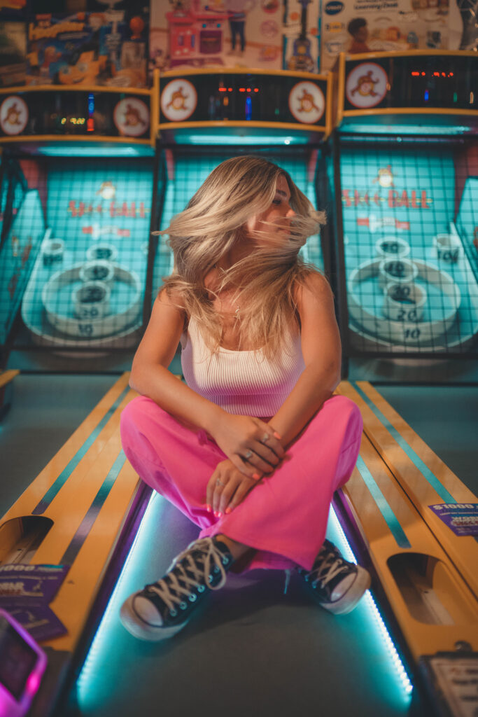 Modern senior image in arcade by NJ photographer Susan Grace